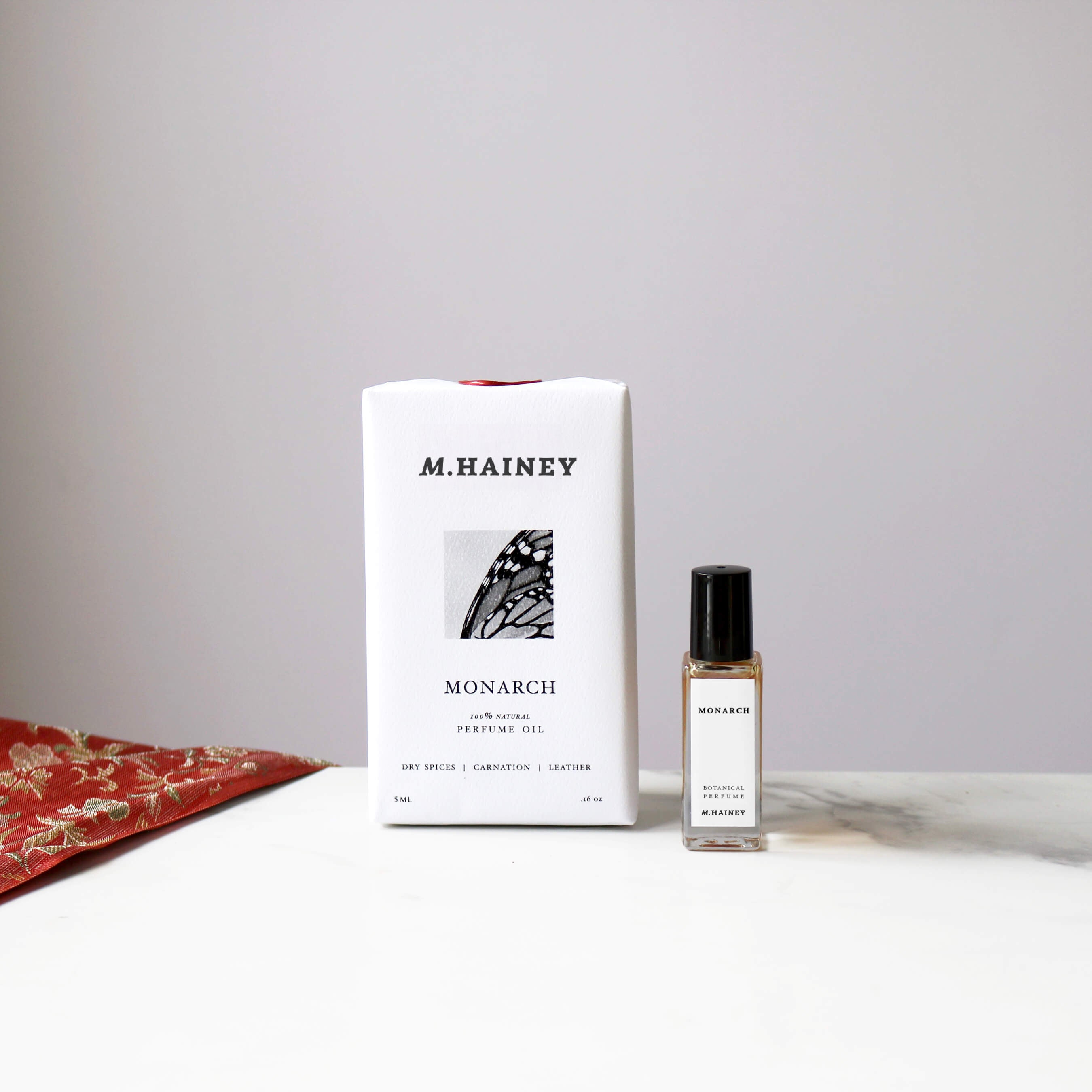 M.HAINEY perfume bottle and packaging on a neutral background