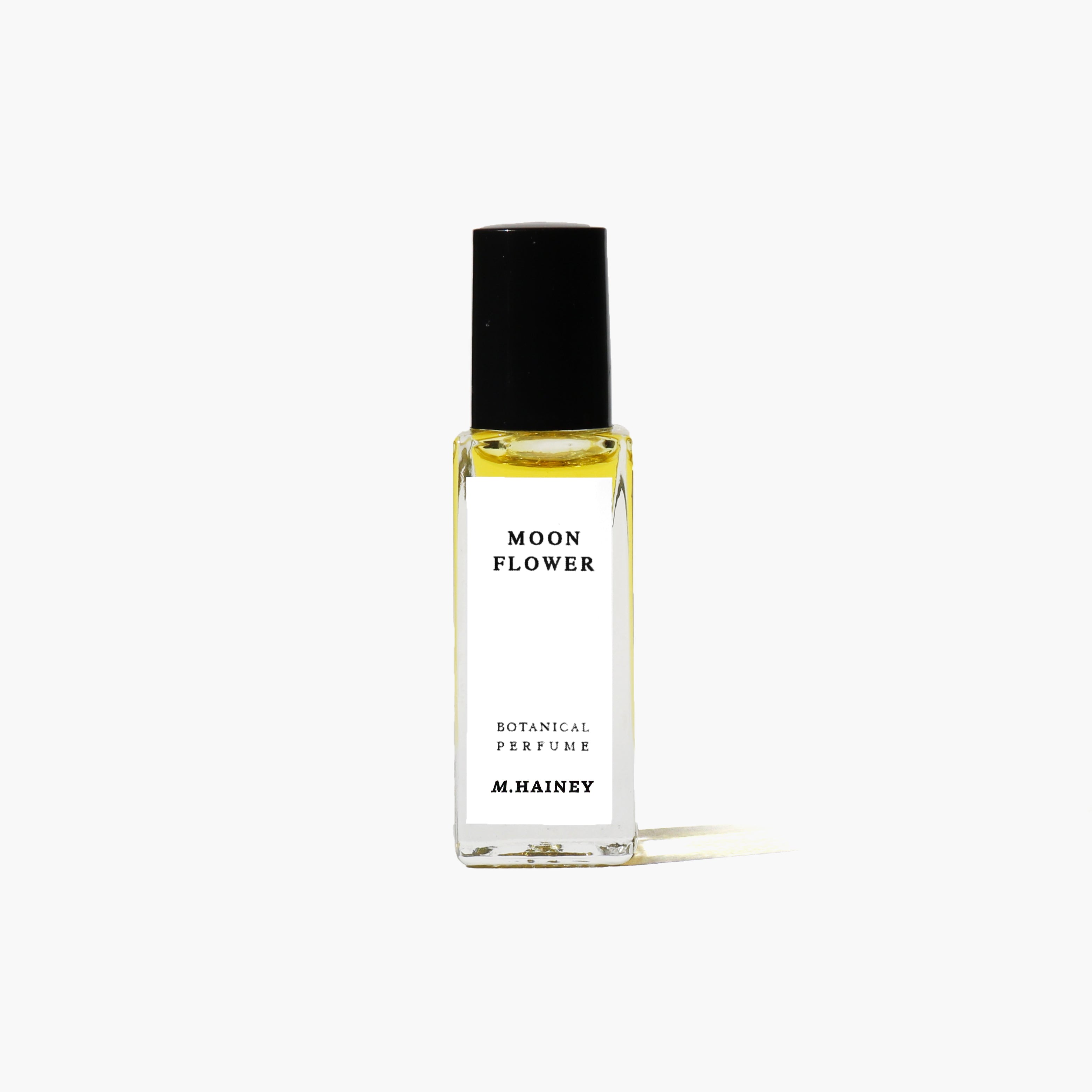 Perfume bottle labeled 'Moon Flower' by M. Hainey on a white background