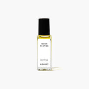 Perfume bottle labeled 'Moon Flower' by M. Hainey on a white background