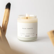 Palo Santo candle with a label on a light background